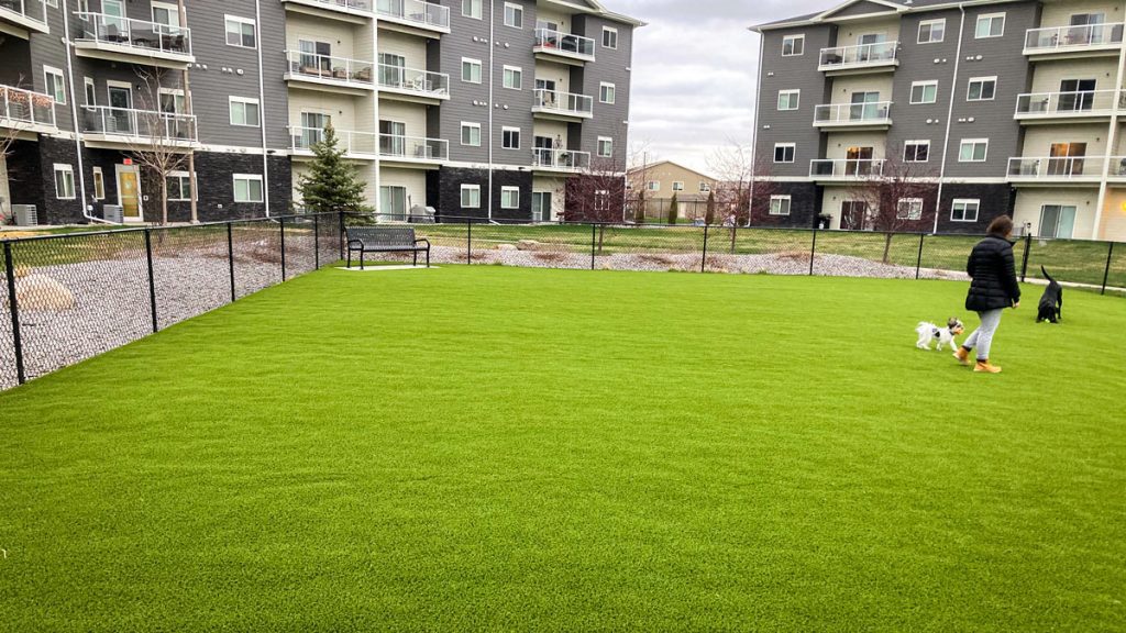 Greystone apartment residents enjoying landscaping project for outdoor recreational space.