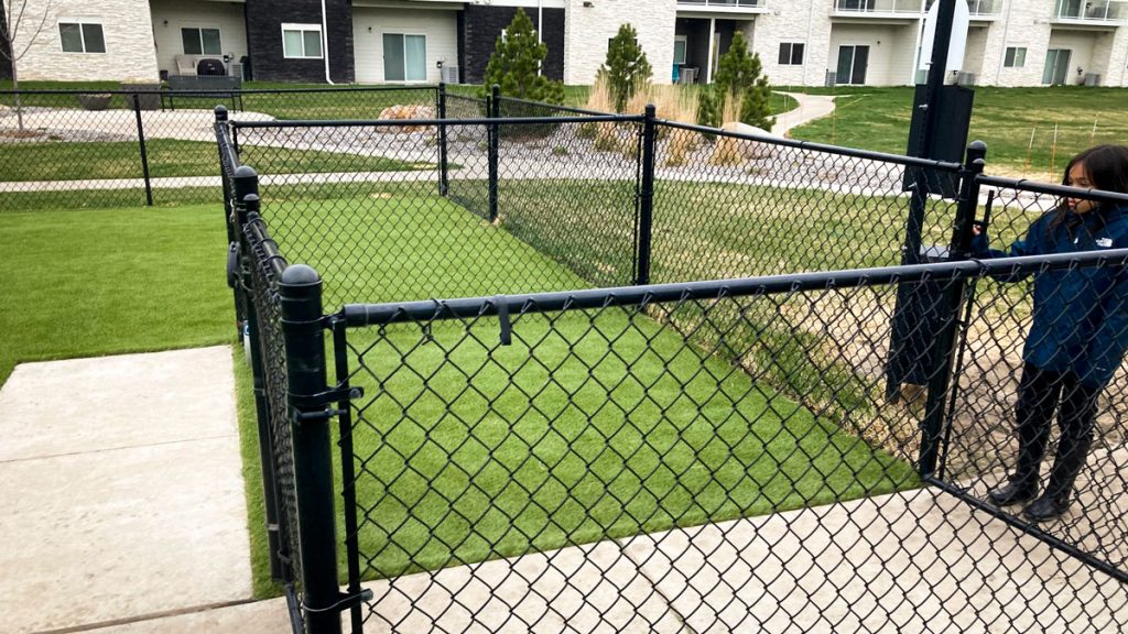 Young girl entering the newly renovated outdoor space for Greystone Apartments.